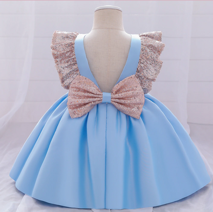 Toddler girl in a sparkling sequin bow plaid dress, ideal Christmas dress for special occasions