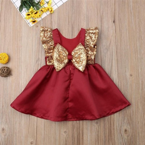 Full view of a girls' Christmas sequin bow plaid dress, red & green holiday fashion for toddlers