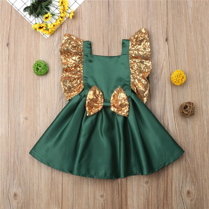 Baby girl in a stylish sequin bow plaid dress, perfect for Christmas celebrations & parties