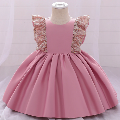 Elegant girls' Christmas dress featuring a sequin bow and classic plaid pattern, holiday wear