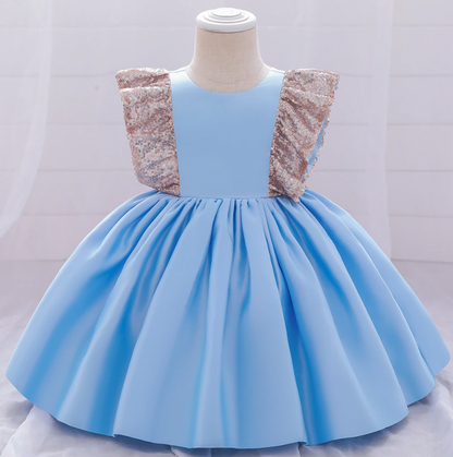 Back view of a girls' Christmas sequin bow plaid dress, adorable festive wear for baby girls