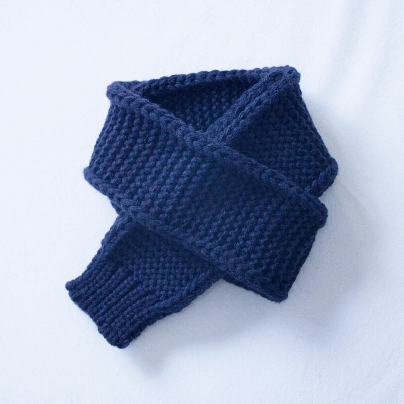 Detailed shot of the knit pattern on a warm, soft girls' infinity scarf