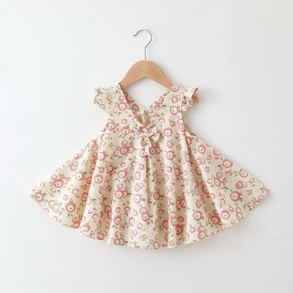 Close-up of the floral print on a girls' cotton summer dress, A-line design.