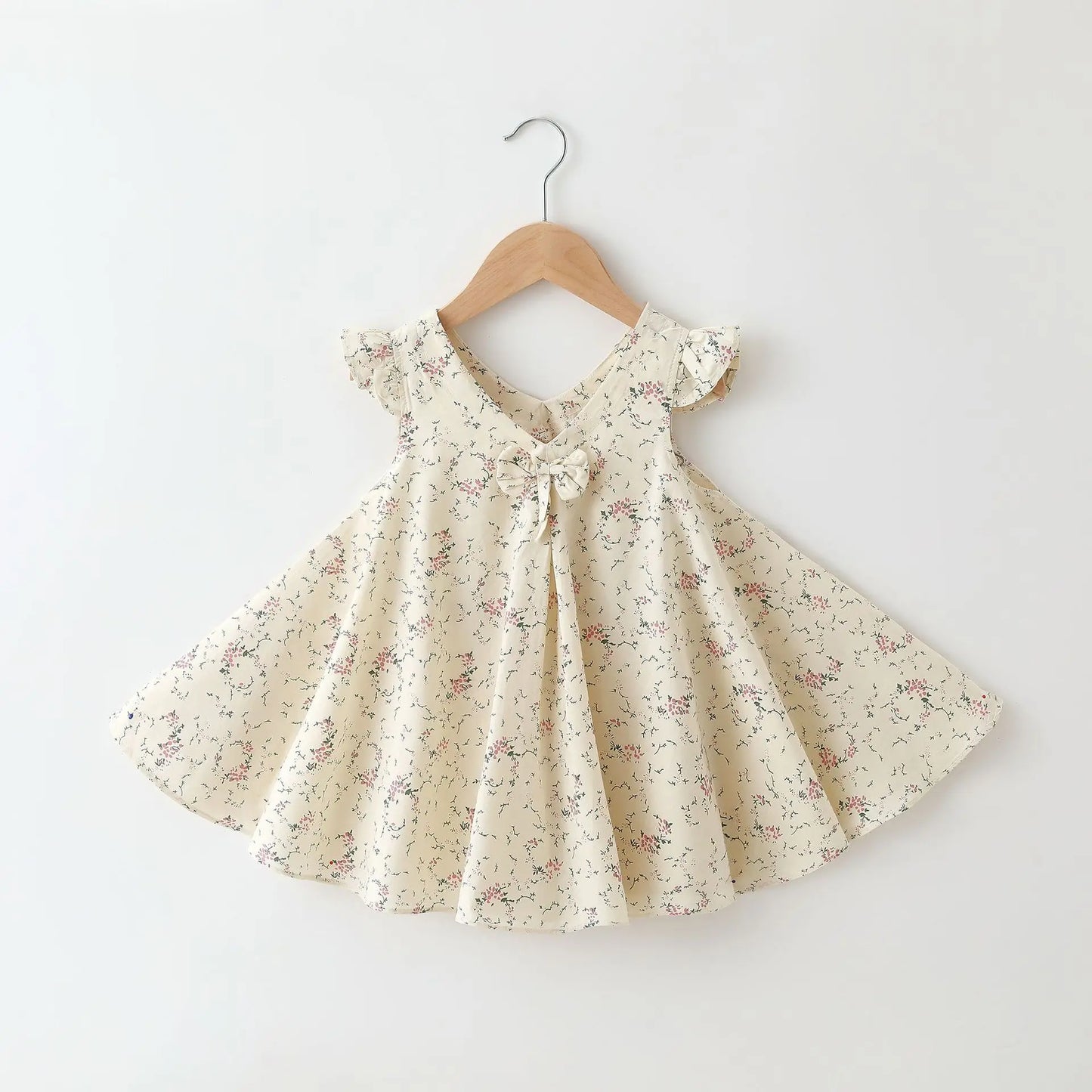 Back view of a girls' A-line cotton summer dress featuring a colorful floral pattern.