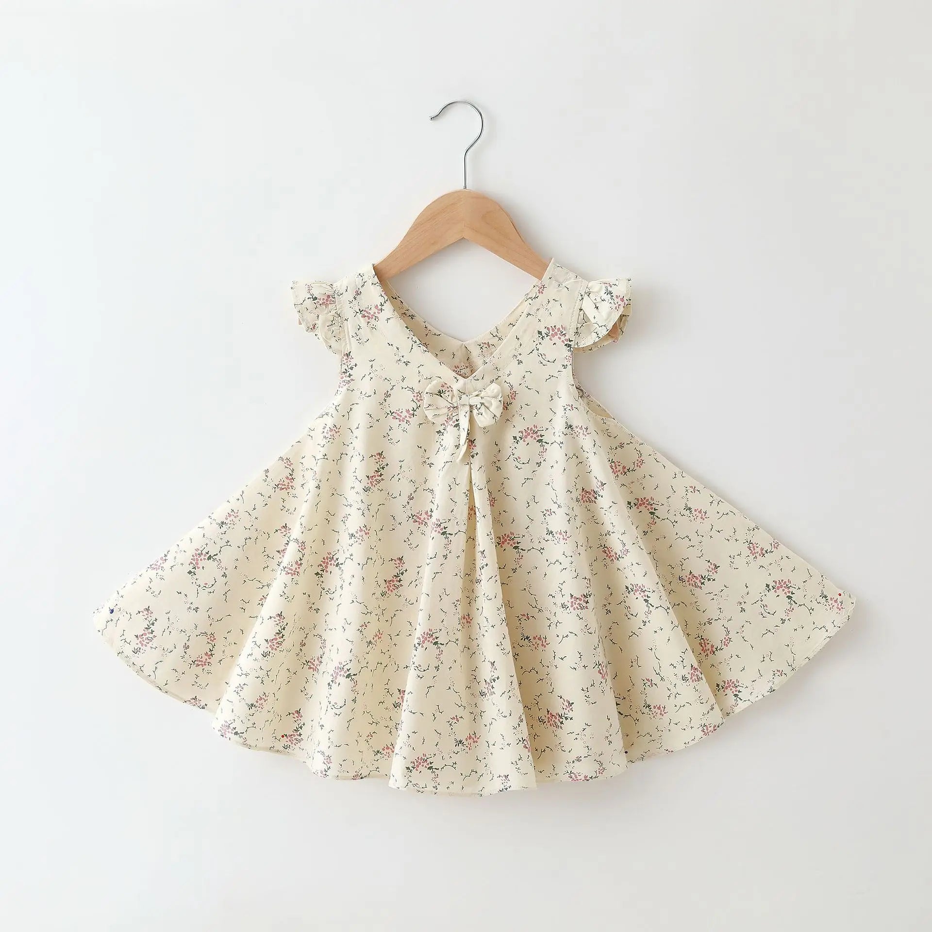 Back view of a girls' A-line cotton summer dress featuring a colorful floral pattern.