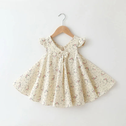 Back view of a girls' A-line cotton summer dress featuring a colorful floral pattern.