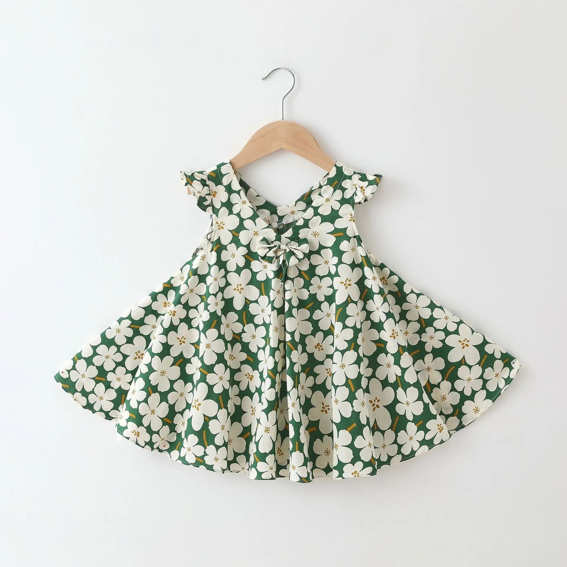 Hanging display of a girls' cotton floral summer dress, an essential A-line kids fashion item.