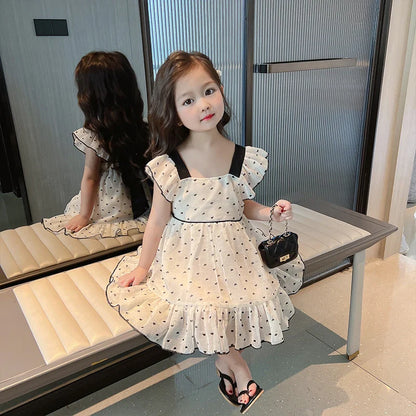 Toddler girl wearing a comfortable and stylish heart pattern casual dress for summer outings