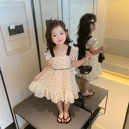 Soft cotton girls' dress featuring an all-over heart pattern, suitable for youth fashion