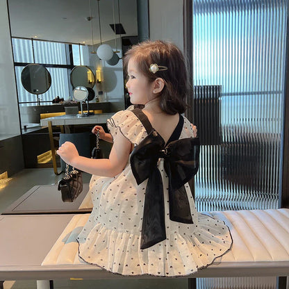 Childrens clothing: a cheerful heart pattern play dress for toddlers, made from cotton