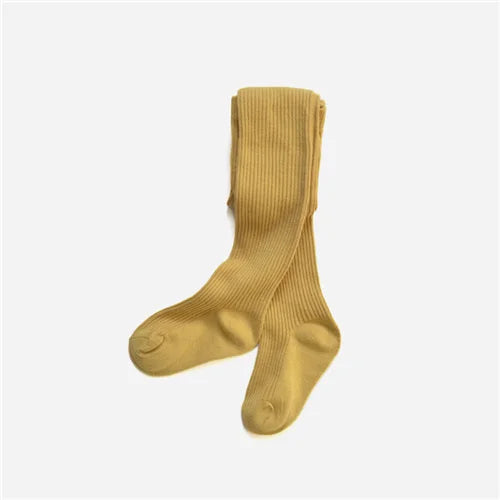 A collection of colorful girls' cotton knitted tights, highlighting various solid color options for kids.