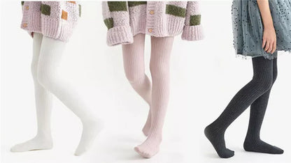 Girls' cozy white cotton knitted tights, perfect for layering and creating comfortable elegant outfits.