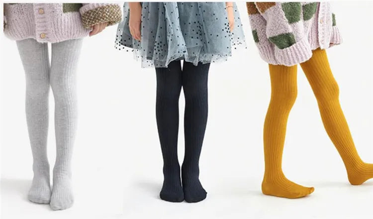 Elastic waistband of girls' cotton knitted leggings, providing a gentle yet secure fit for toddlers.