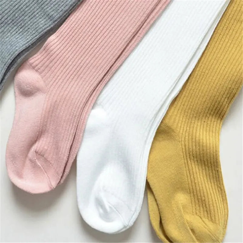 Girls' cotton knitted tights, featuring a comfortable waistband for all-day spring and autumn wear.