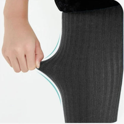 A pair of soft pink girls' cotton knitted tights, essential children's apparel for comfortable fashion.