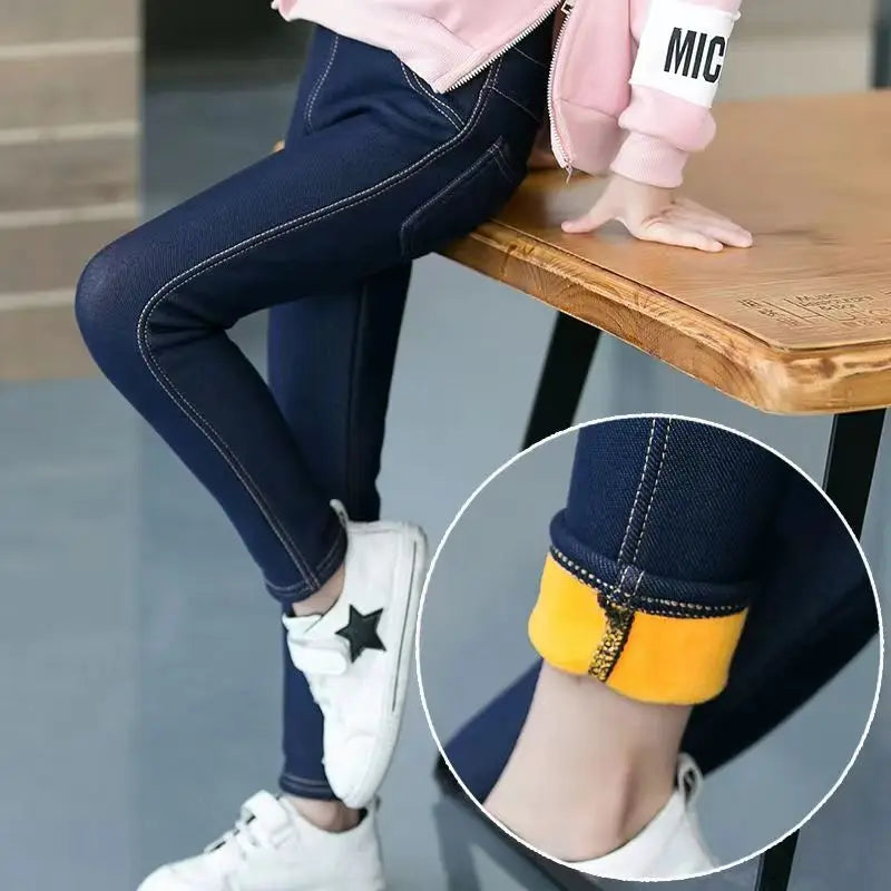 Warm girls' denim leggings with elastic waist, perfect for fall & winter playwear & kids fashion apparel.