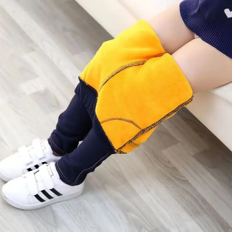 Stylish girls' winter denim leggings, super cozy for cold weather. A perfect warm bottom for children.