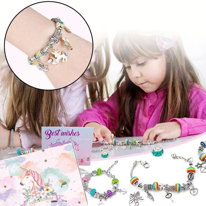 Sparkling charms & colorful beads from a girls' jewelry making kit, ideal for creative DIY projects.