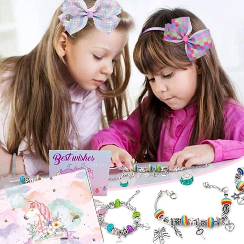 A girl's hands assembling a bracelet using the Creative Jewelry Making Kit with shiny charms.