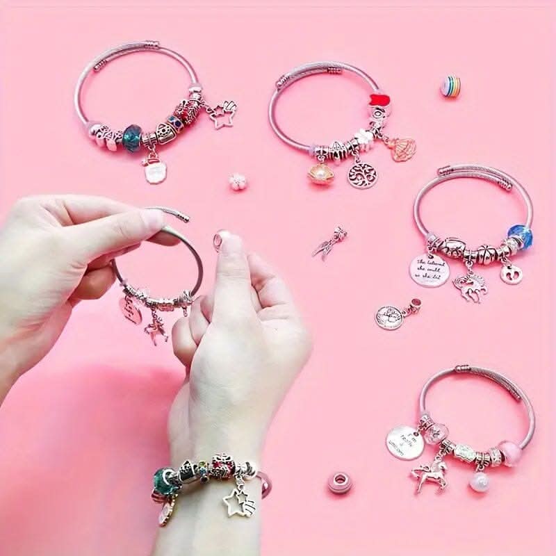 Finished DIY bracelets made with the Girls' Creative Jewelry Making Kit, featuring various sparkling charms.