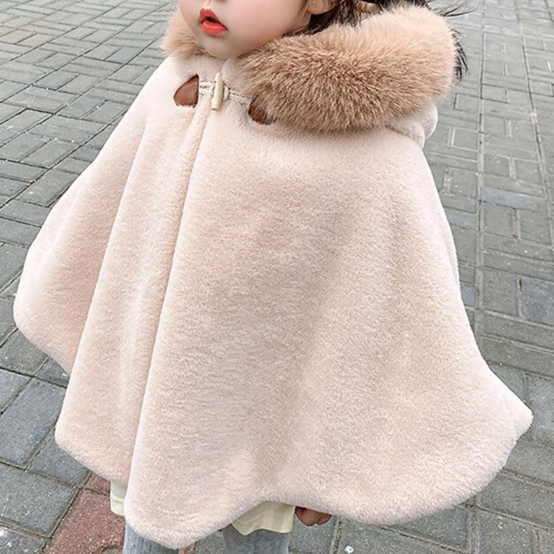 Cute baby girl in a cozy faux fur hooded short cloak, perfect for holiday outfits