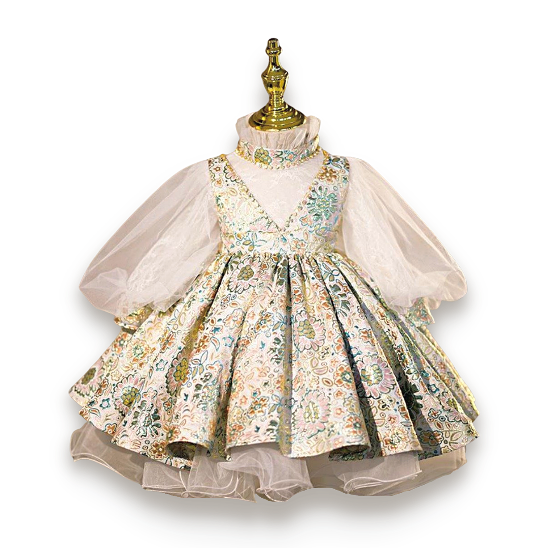 Close-up of the delicate lace and floral details on a girls' white princess ball gown dress