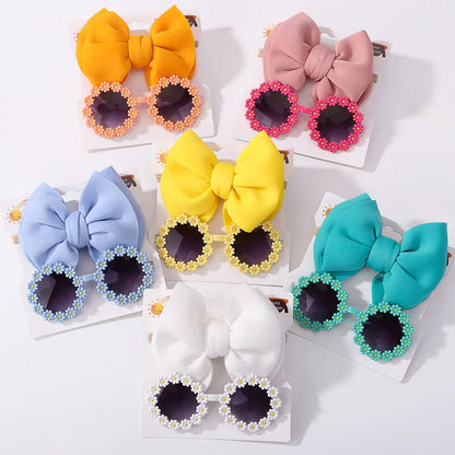 Close-up of the textured bow headband from the girls' sunglasses and hair accessory set