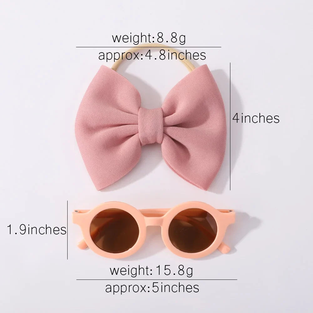 Girls' sunglasses with a secure fit and a matching bow headband, ideal for active kids