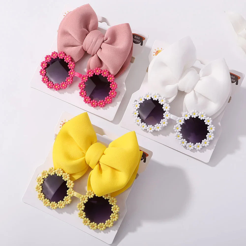 Pink girls' sunglasses with matching bow headband, essential children's summer style accessory