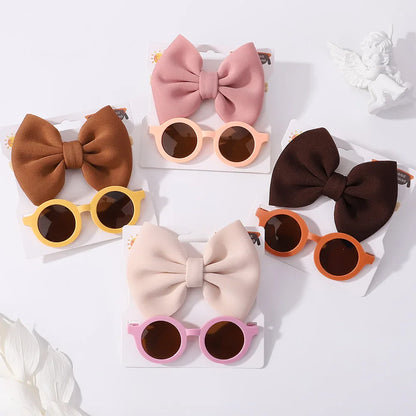 Girls' outdoor wear set: resilient sunglasses and an adorable bow headband for young fashionistas