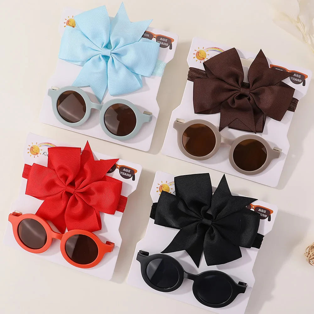 Gift-ready girls' accessory set featuring fashionable sunglasses and a chic bow headband