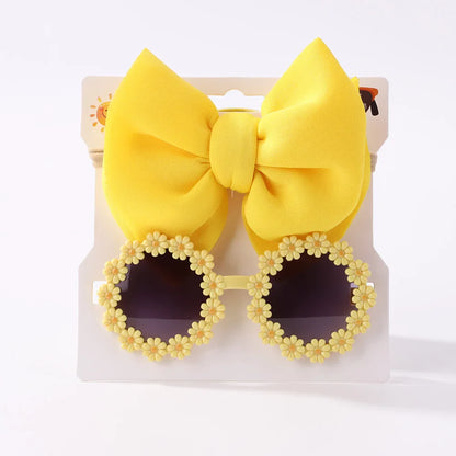 Children's fashion sunglasses with tinted lenses and a comfortable pink bow hairband