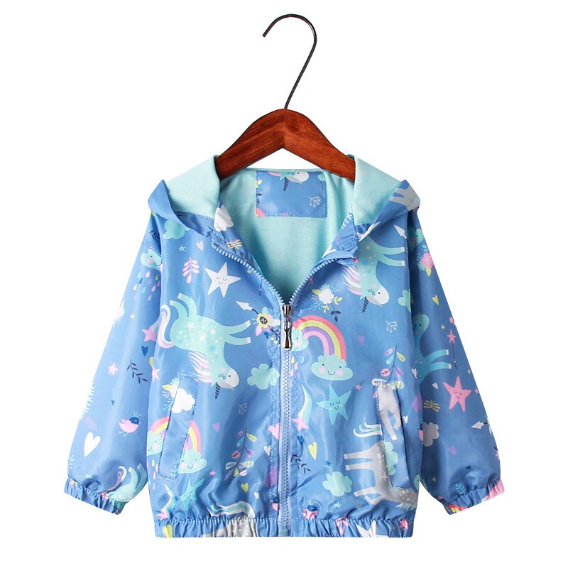 Young girl wearing floral graffiti hooded windbreaker, active kids outerwear in autumn park