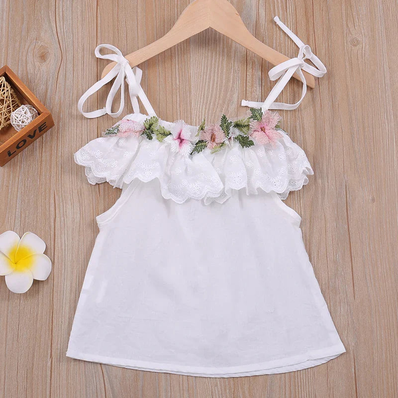 Close-up of girls' floral print cotton lycra halter top with ruffled trim, comfy summer wear