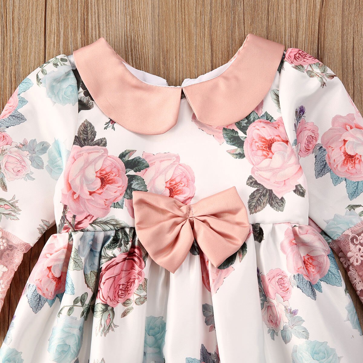 Toddler girl's party dress, pastel floral lace with delicate bow, a beautiful summer choice.