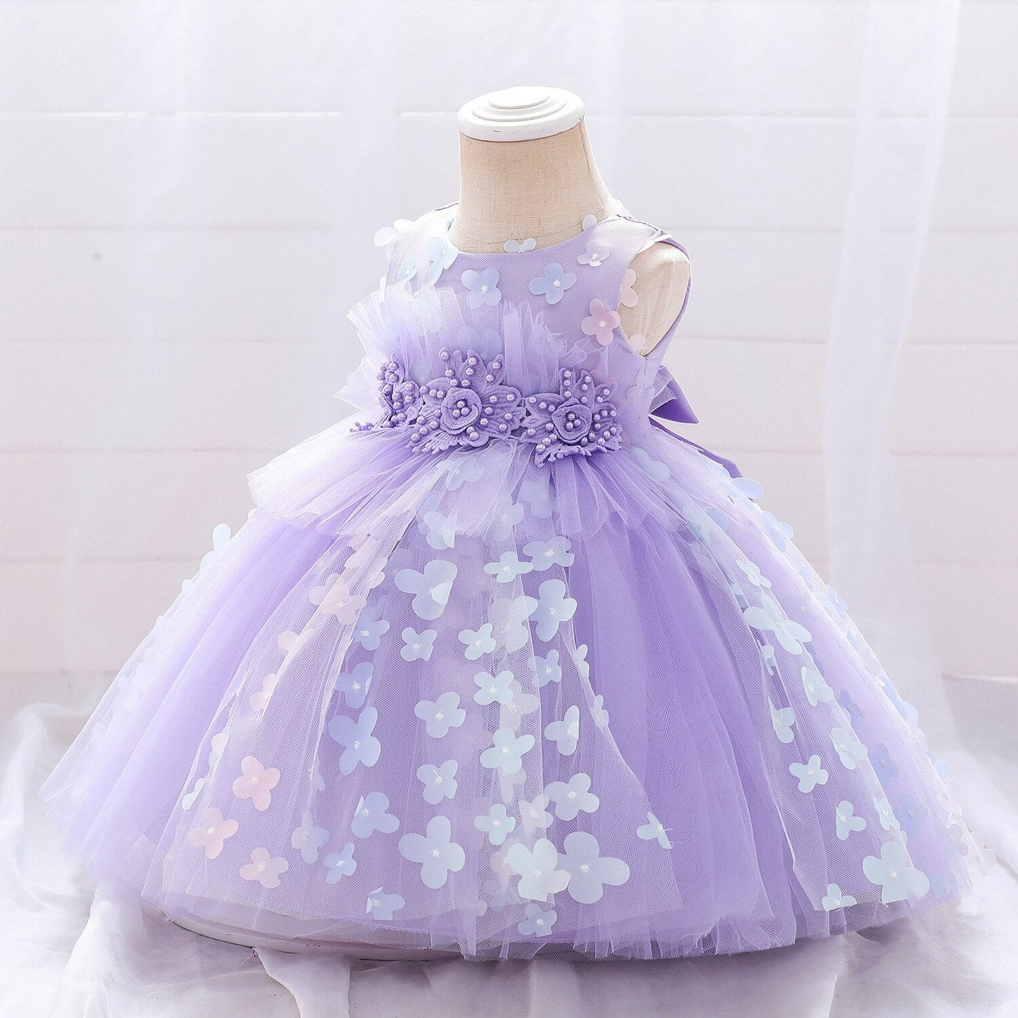Close-up of the elegant embroidery on a girls' floral lace princess party dress