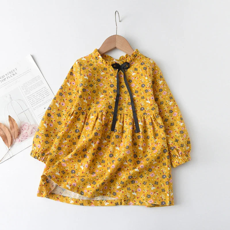 Childrens apparel: a vibrant floral princess dress with long sleeves, a must-have for spring fashion.