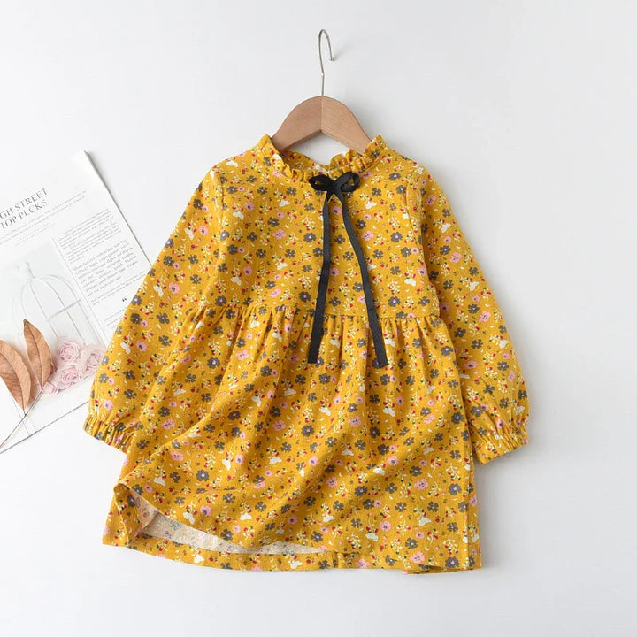 Childrens apparel: a vibrant floral princess dress with long sleeves, a must-have for spring fashion.