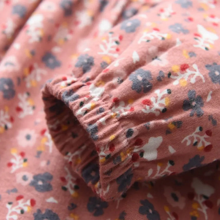 Playful girls floral princess dress with long sleeves, ideal for casual spring and autumn adventures.
