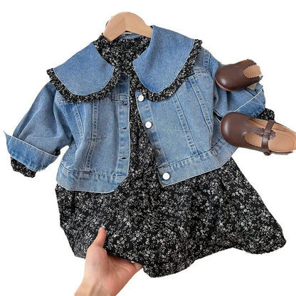 Detail of girl's floral dress fabric, showing high-quality print and delicate colors for toddler wear.