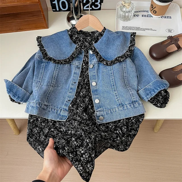 Flat lay of girls' floral dress and denim jacket, highlighting the complete two-piece spring outfit.