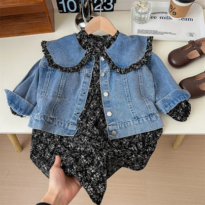 Flat lay of girls' floral dress and denim jacket, highlighting the complete two-piece spring outfit.