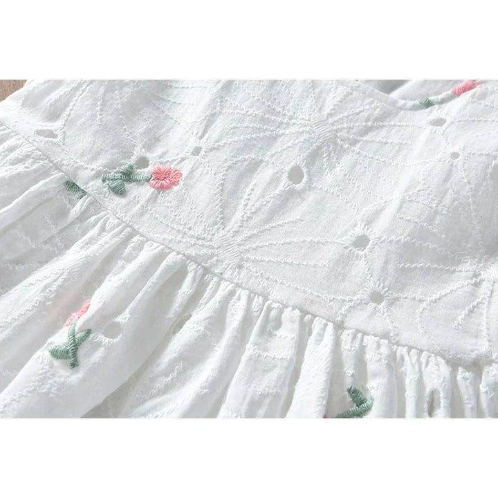 Close-up of the elegant floral print on a girls sleeveless princess dress, a-line cut, kids fashion