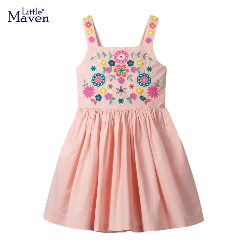 Close-up of vibrant floral print on girls' summer dress, soft cotton fabric