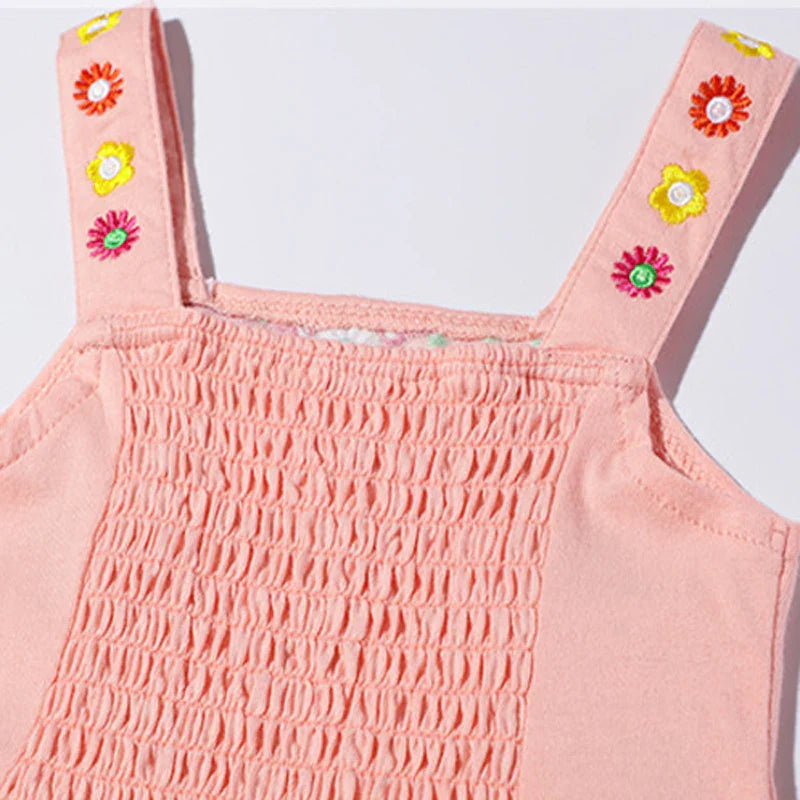 Back view of girls' floral summer dress, showing comfortable sleeveless design