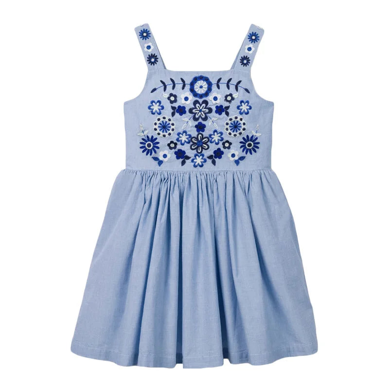 Girls' floral summer dress in a bright setting, emphasizing its playful beach style
