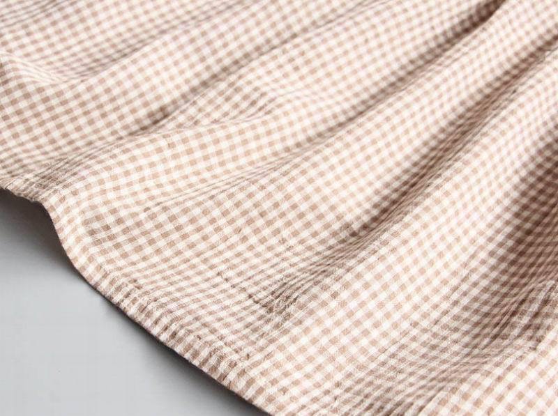 Baby girl's comfortable gingham play dress. A stylish cotton frock, ideal for everyday wear and summer kids' fashion.