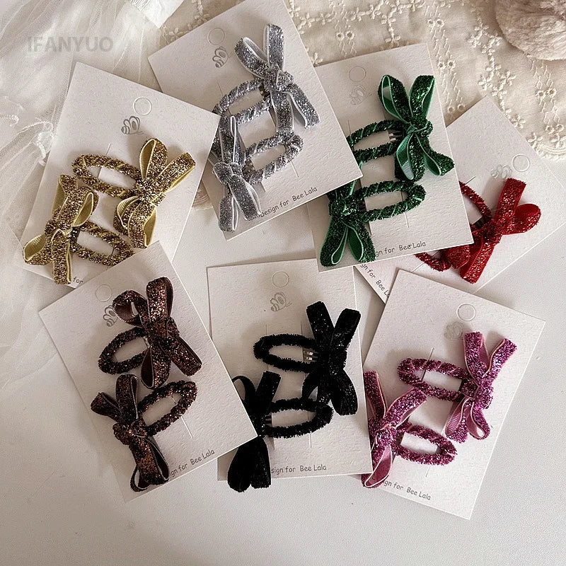 Sparkling glitter bow hair clips for girls, ideal for Christmas and birthday outfits.
