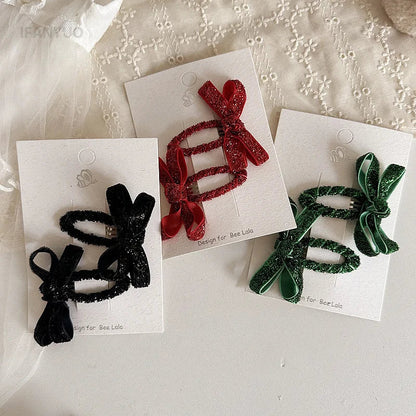 Cute pink glitter bow hair clips for baby girls, perfect for party wear and fashion.