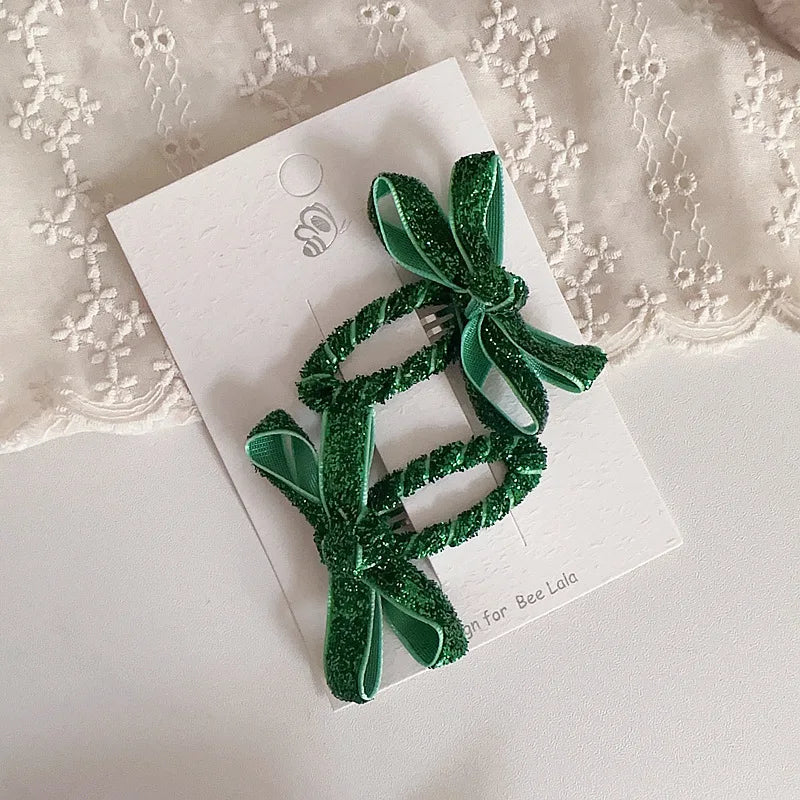 Shimmering bow hairpins for toddlers, an adorable addition to any young girl's look.